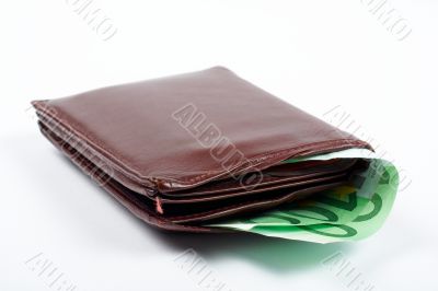 Old leather wallet with bills inside