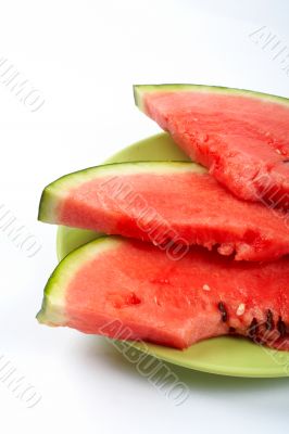 Watermelon slices on the green plate