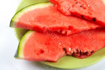 Watermelon slices on the green plate