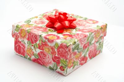 Gift box with red ribbon, on white background