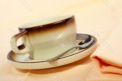 Close-up of a cup of coffee with the spoon