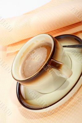 Close-up of a cup of coffee with the spoon