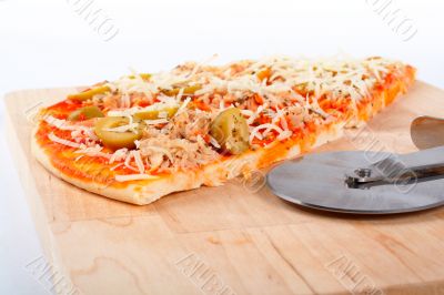Detail of slices Italian pizza and cutter