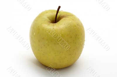 Yellow apple with drops