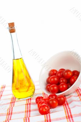 Olive oil bottle and tomatos cherry