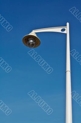 Lamppost over the blue sky