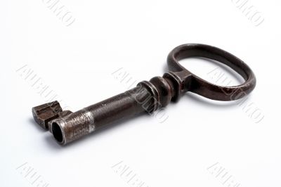Old key on white background