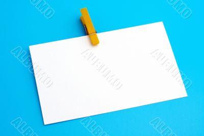 Isolated white paper with yellow clamp
