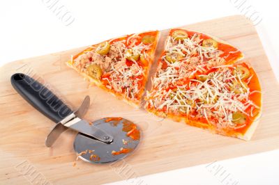 Slices of Italian pizza and cutter