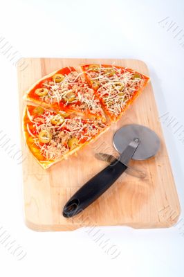 Slices of Italian pizza and cutter