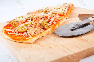 Detail of slices Italian pizza and cutter