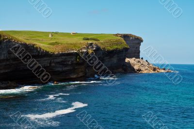 Green meadow on cliffs