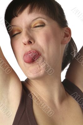 young woman shows her tongue