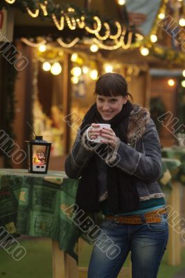 young woman drinks glogg