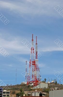 Red and White Towers on Hill