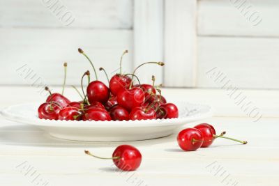 Cherries on a white plate