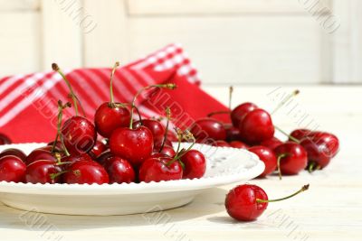 Red cherries on a plate