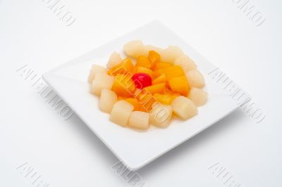 Fresh fruit salad on the white plate