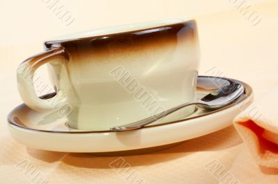 Close-up of a cup of coffee with the spoon