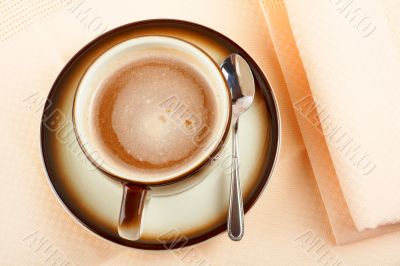 Close-up of a cup of coffee with the spoon