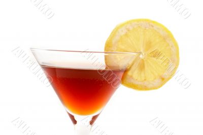Detail of red cocktail with lemon