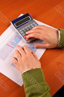 Business woman calculating