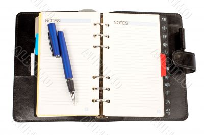 Opened agenda with the pen