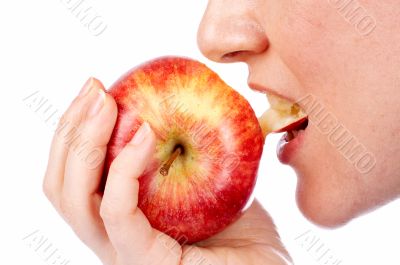 Girl eating a red apple