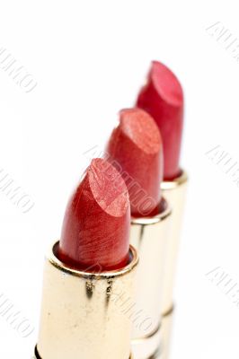 Three tubes of red lipstick