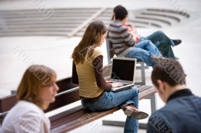 businesswoman outdoors with notebook