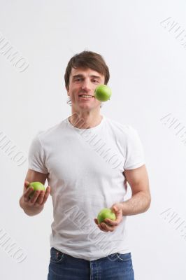 juggling green apples