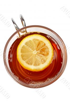 Glass cup of tea with lemon