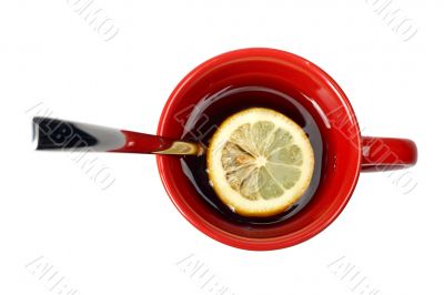 Red cup of tea with lemon and the spoon