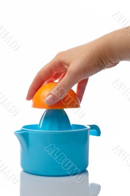 Woman squeezing orange
