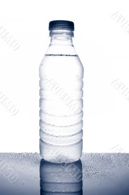 Bottle of mineral water with droplets