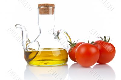 Tomatoes and oilcan