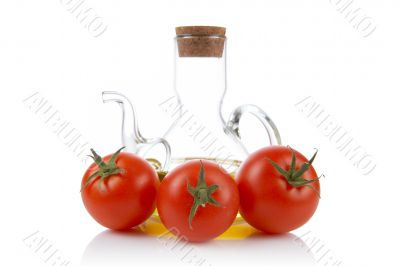 Tomatoes and oilcan
