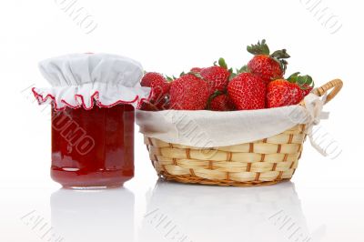 Jam jar and basket of strawberries