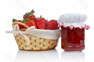 Jam jar and basket of strawberries