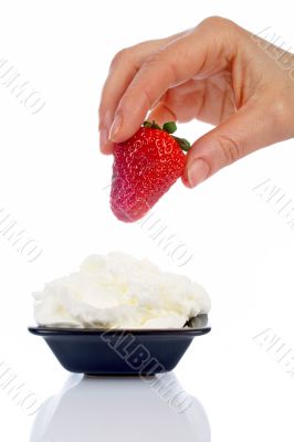 Woman hand strawberry