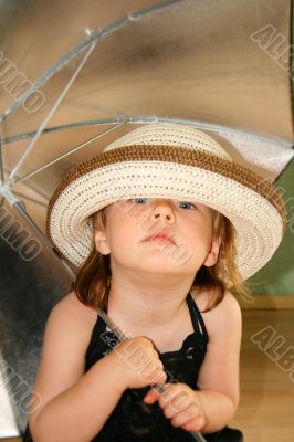 Small girl with umbrella