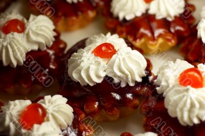 small cupcakes with cream and cherry #1