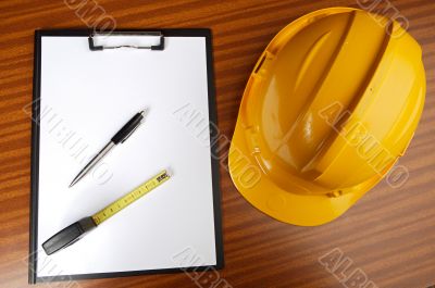 yellow helmet and notepad