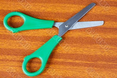 green scissors on a table