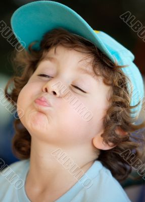 adorable happy boy making trivialities