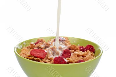Cornflakes with milk being poured
