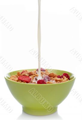 Cornflakes with milk being poured