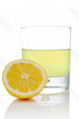 Half and glass of fresh lemon juice