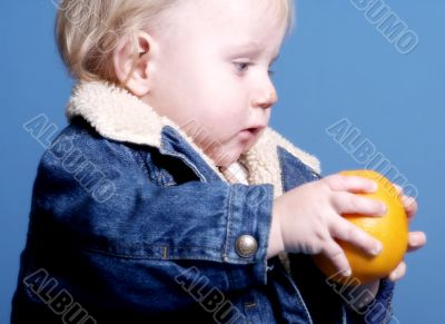 child with orange