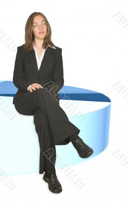 business woman sitting on pie chart closeup